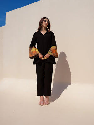 This earthy-toned kurta blends comfort with effortless elegance. Featuring hand-painted cuffs that add a subtle pop of color, the design offers a refined yet stylish look, perfect for understated everyday dressing.