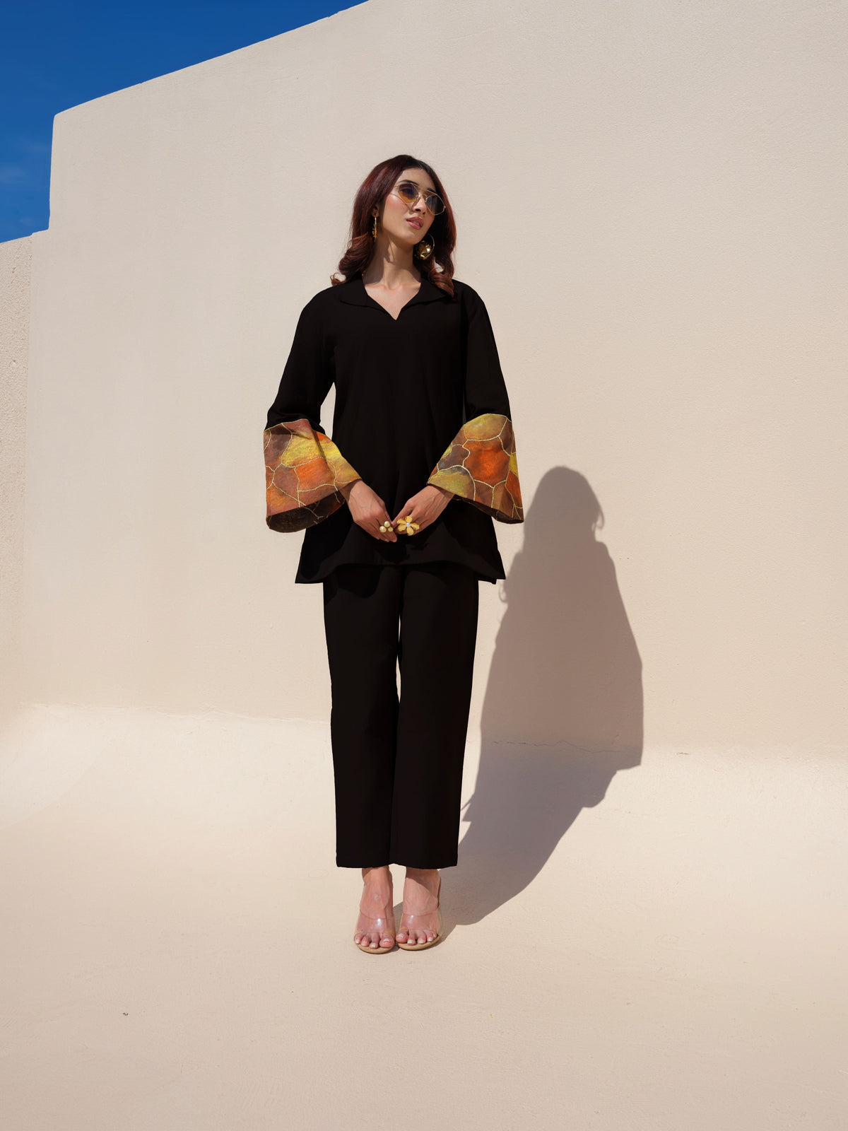 This earthy-toned kurta blends comfort with effortless elegance. Featuring hand-painted cuffs that add a subtle pop of color, the design offers a refined yet stylish look, perfect for understated everyday dressing.