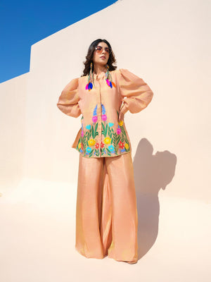 This elegant top showcases delicate hand-painted rose motifs that celebrate femininity and sophistication. Crafted in luxurious fabric, it offers exceptional comfort with a graceful silhouette, blending timeless elegance with contemporary style. Thoughtfully designed and beautifully detailed, it reflects the beauty of meticulous craftsmanship in every stroke.