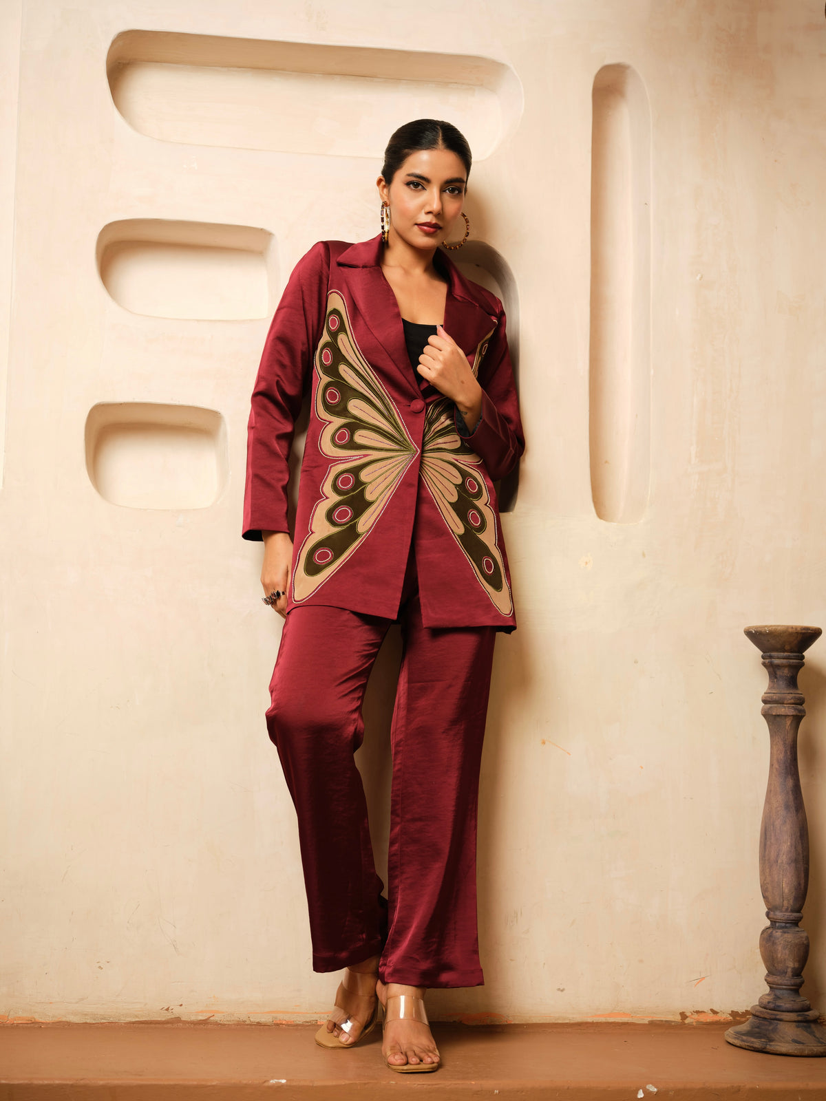 Crafted from luxurious *Imported Satin, this statement *Blazer Co-ord Set&nbsp; features a striking *butterfly appliqué design* enhanced with intricate hand embroidery. The tailored silhouette and artisanal detailing create a perfect balance of elegance and contemporary style, making it an ideal choice for festive occasions, evening events, and special celebrations
