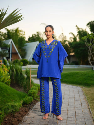 This elegant kurta features delicately hand-painted leaf motifs that celebrate the beauty of nature. Inspired by the vibrant hues of a botanical garden, it blends artistic expression with refined craftsmanship, creating a timeless and distinctive look.