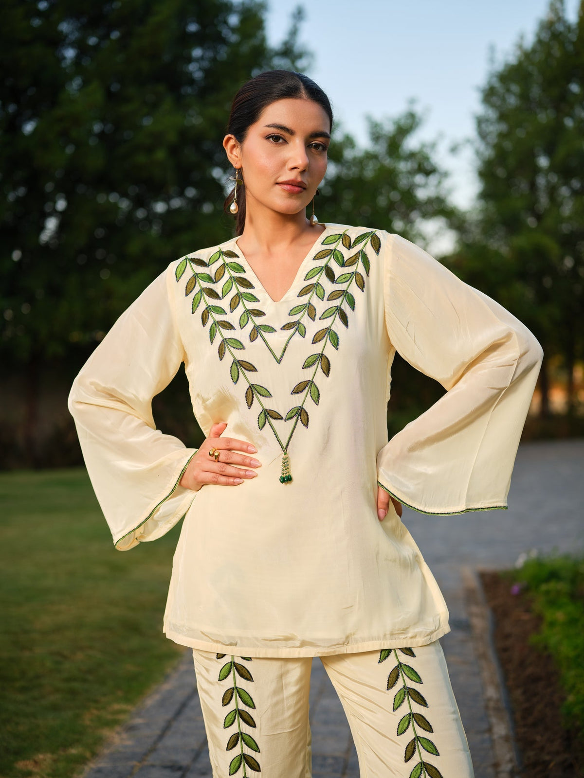 This elegant kurta features delicately hand-painted leaf motifs that celebrate the beauty of nature. Inspired by the vibrant hues of a botanical garden, it blends artistic expression with refined craftsmanship, creating a timeless and distinctive look.