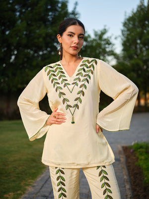 This elegant kurta features delicately hand-painted leaf motifs that celebrate the beauty of nature. Inspired by the vibrant hues of a botanical garden, it blends artistic expression with refined craftsmanship, creating a timeless and distinctive look.