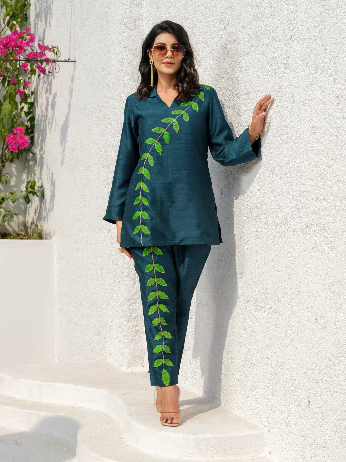 This elegant kurta features delicately hand-painted leaf motifs that celebrate the beauty of nature. Inspired by the vibrant hues of a botanical garden, it blends artistic expression with refined craftsmanship, creating a timeless and distinctive look.