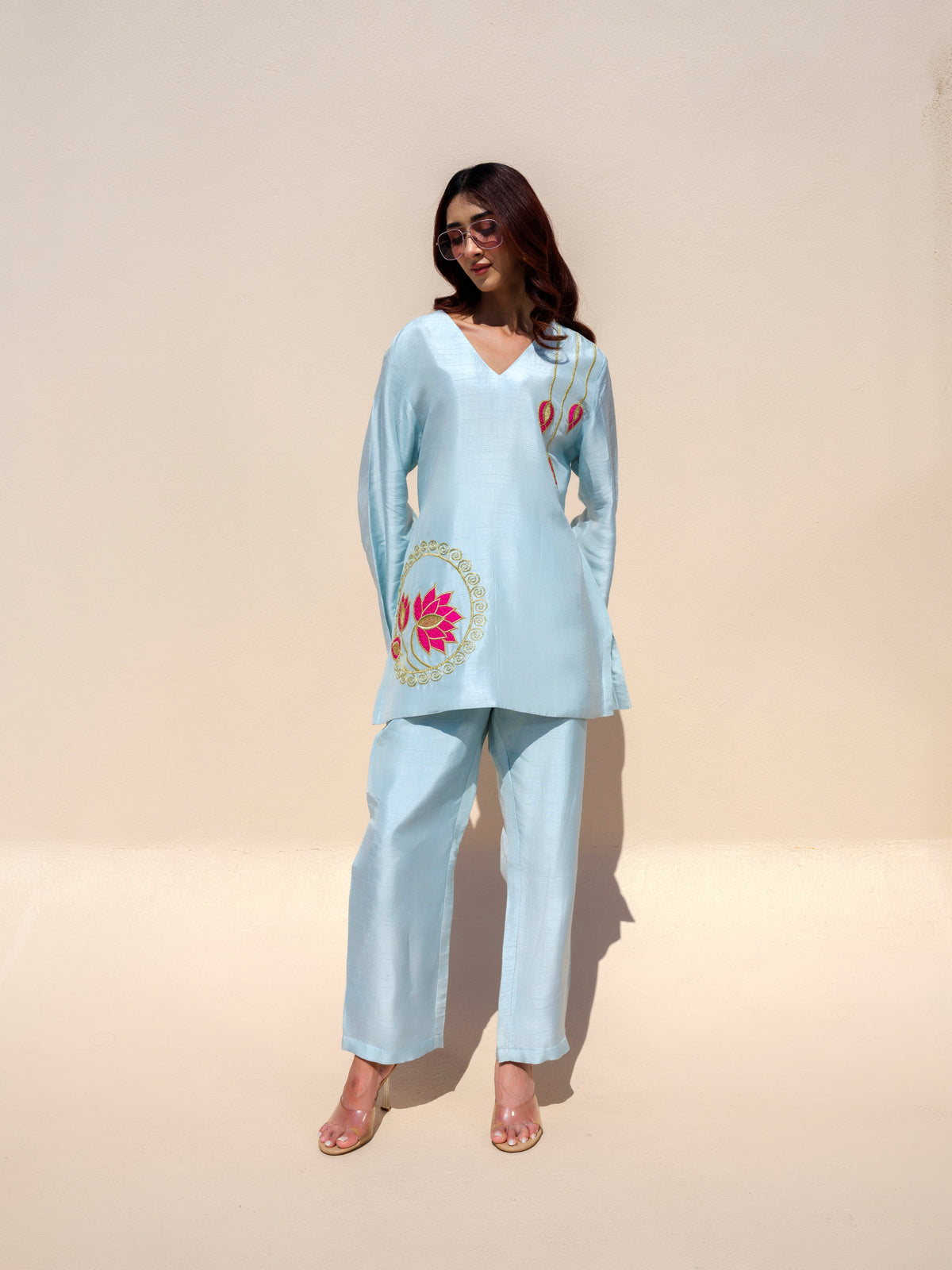 The Nirvana Lotus top beautifully redefines elegance with its dreamy pastel hues and intricate golden detailing. Handcrafted lotus motifs adorn the design, adding a touch of artistry and sophistication that makes it a true standout piece. Blending luxurious craftsmanship with effortless charm, this statement piece embodies timeless grace and contemporary style, making it perfect for festive gatherings and special occasions.