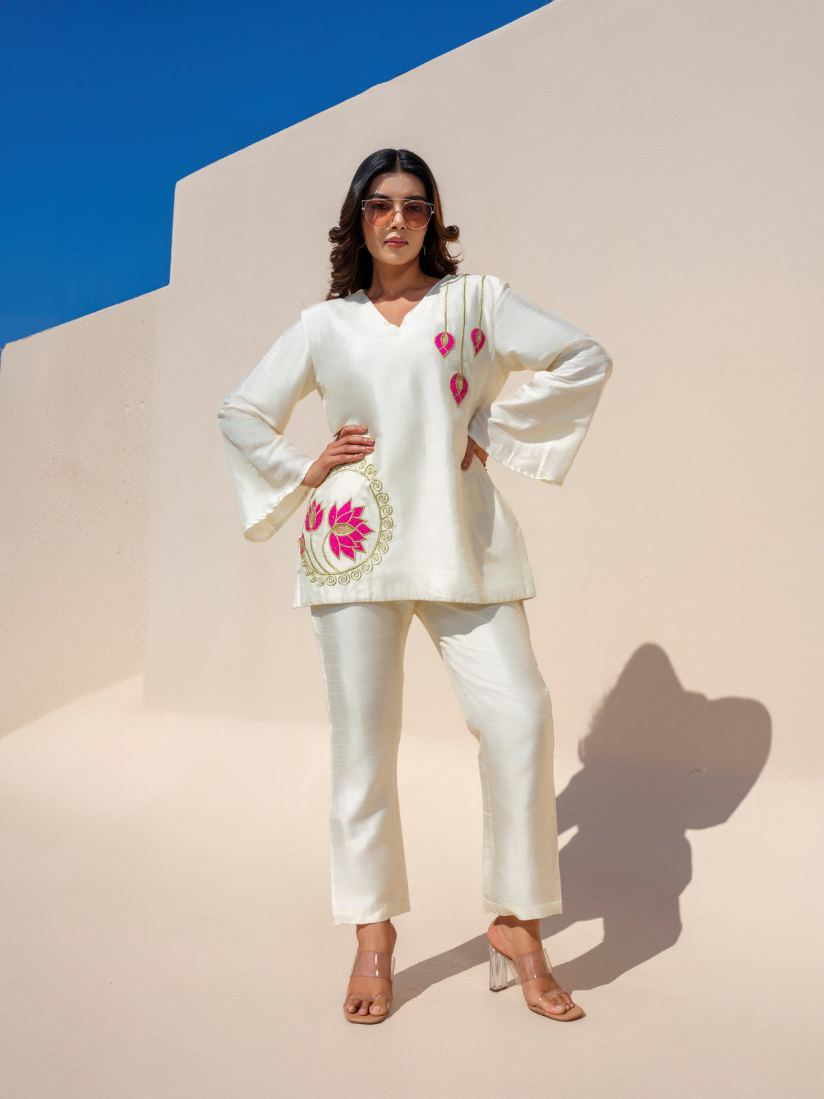 The Nirvana Lotus top beautifully redefines elegance with its dreamy pastel hues and intricate golden detailing. Handcrafted lotus motifs adorn the design, adding a touch of artistry and sophistication that makes it a true standout piece. Blending luxurious craftsmanship with effortless charm, this statement piece embodies timeless grace and contemporary style, making it perfect for festive gatherings and special occasions.