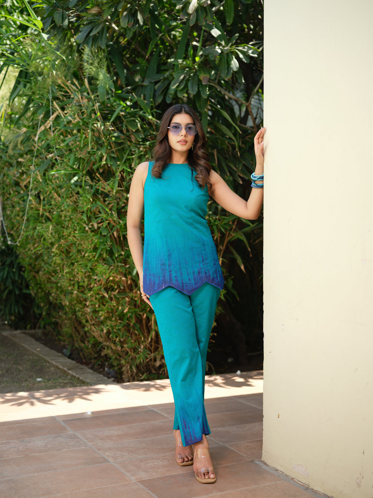 Crafted in soft and breathable mul cotton, this contemporary kurta features unique hand-painted strokes that create a subtle gradient effect, making each piece one of a kind. Designed with a refined silhouette and intricate cutwork detailing, it blends artistic craftsmanship with effortless modern style.
