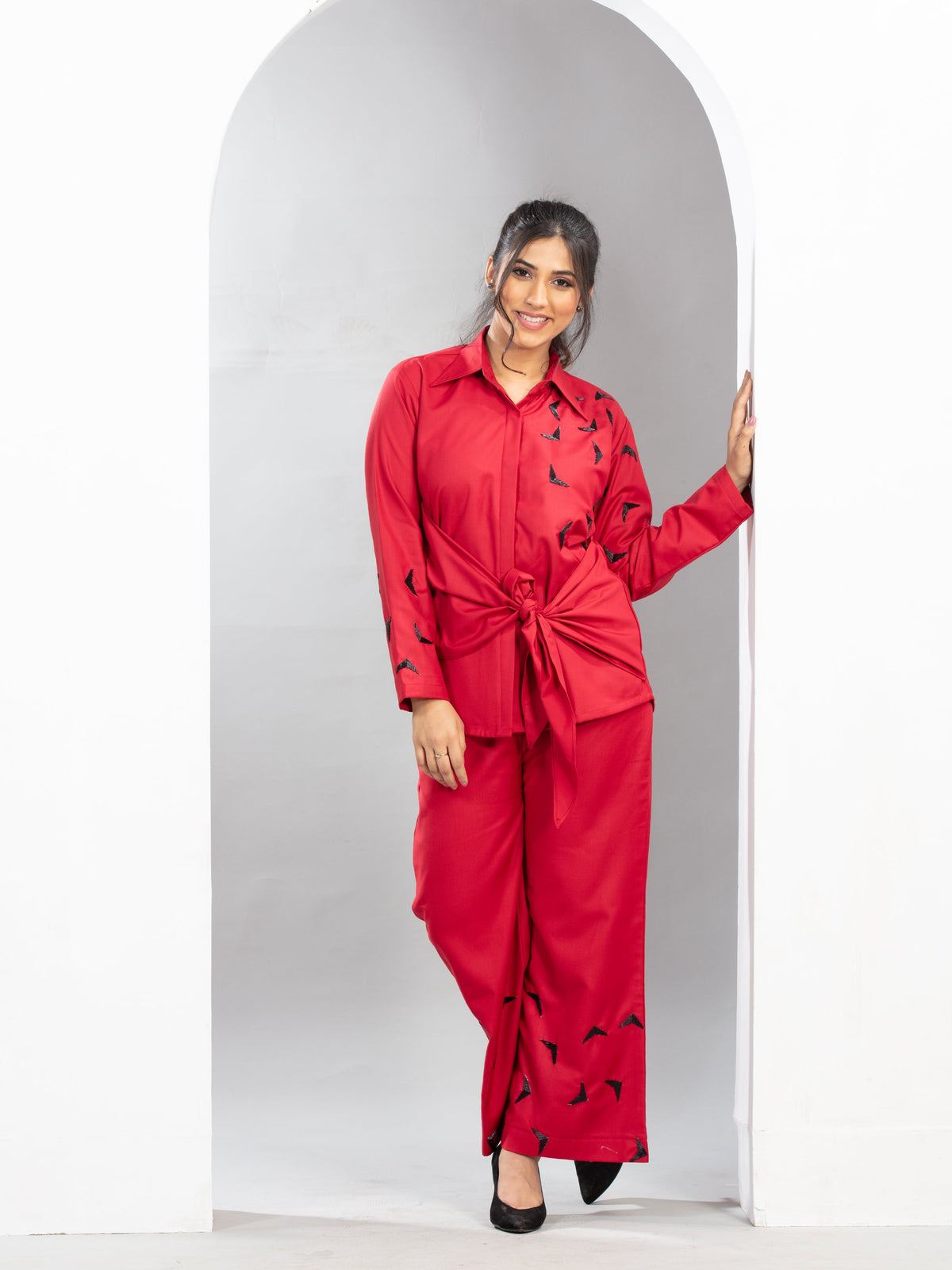 “Trigon” designer shirt features striking triangle handwork with a stylish front knot detail that enhances the silhouette beautifully. Crafted for both style and comfort, the design flatters all body types while offering an effortless and contemporary look throughout wear.