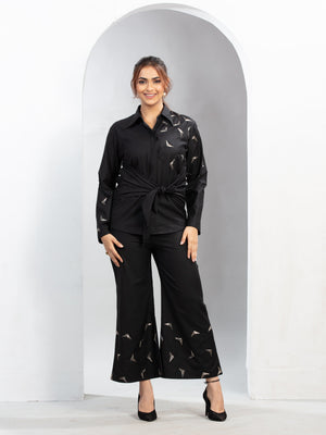 “Trigon” designer shirt features striking triangle handwork with a stylish front knot detail that enhances the silhouette beautifully. Crafted for both style and comfort, the design flatters all body types while offering an effortless and contemporary look throughout wear.
